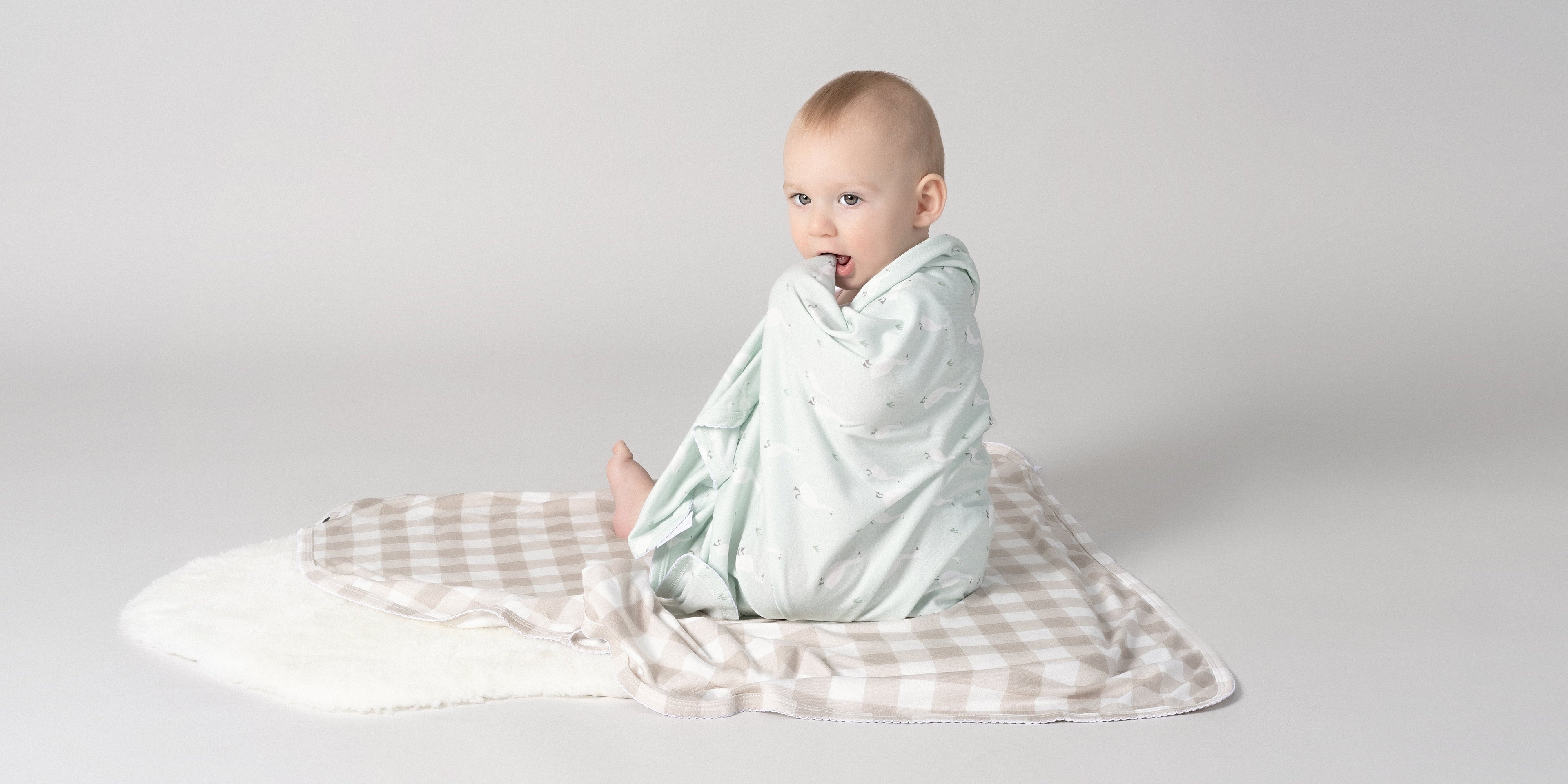 soft stretch baby swaddle wraps in a basket