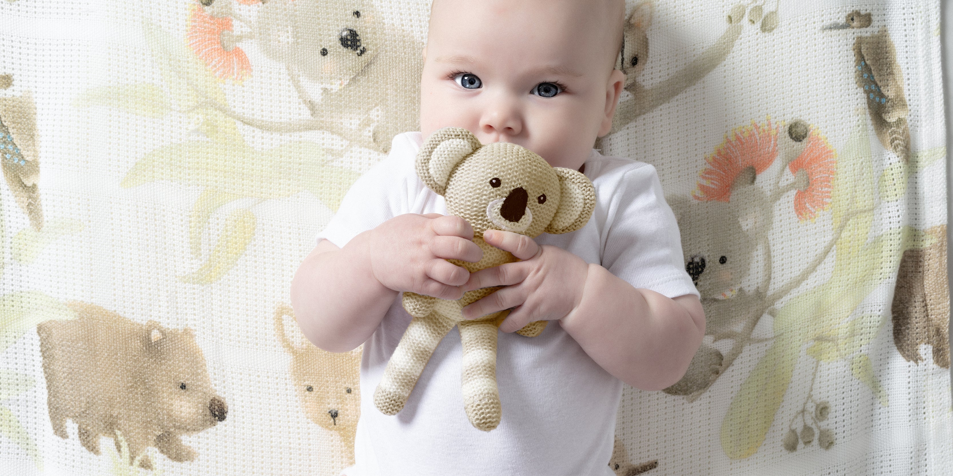 two cute babies wearing nordic print hooded bath towels