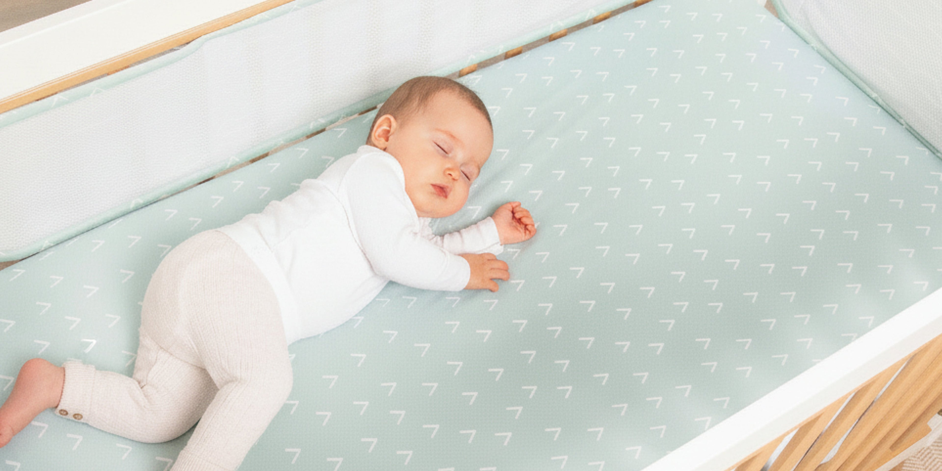 baby nursery with cot fitted sheet