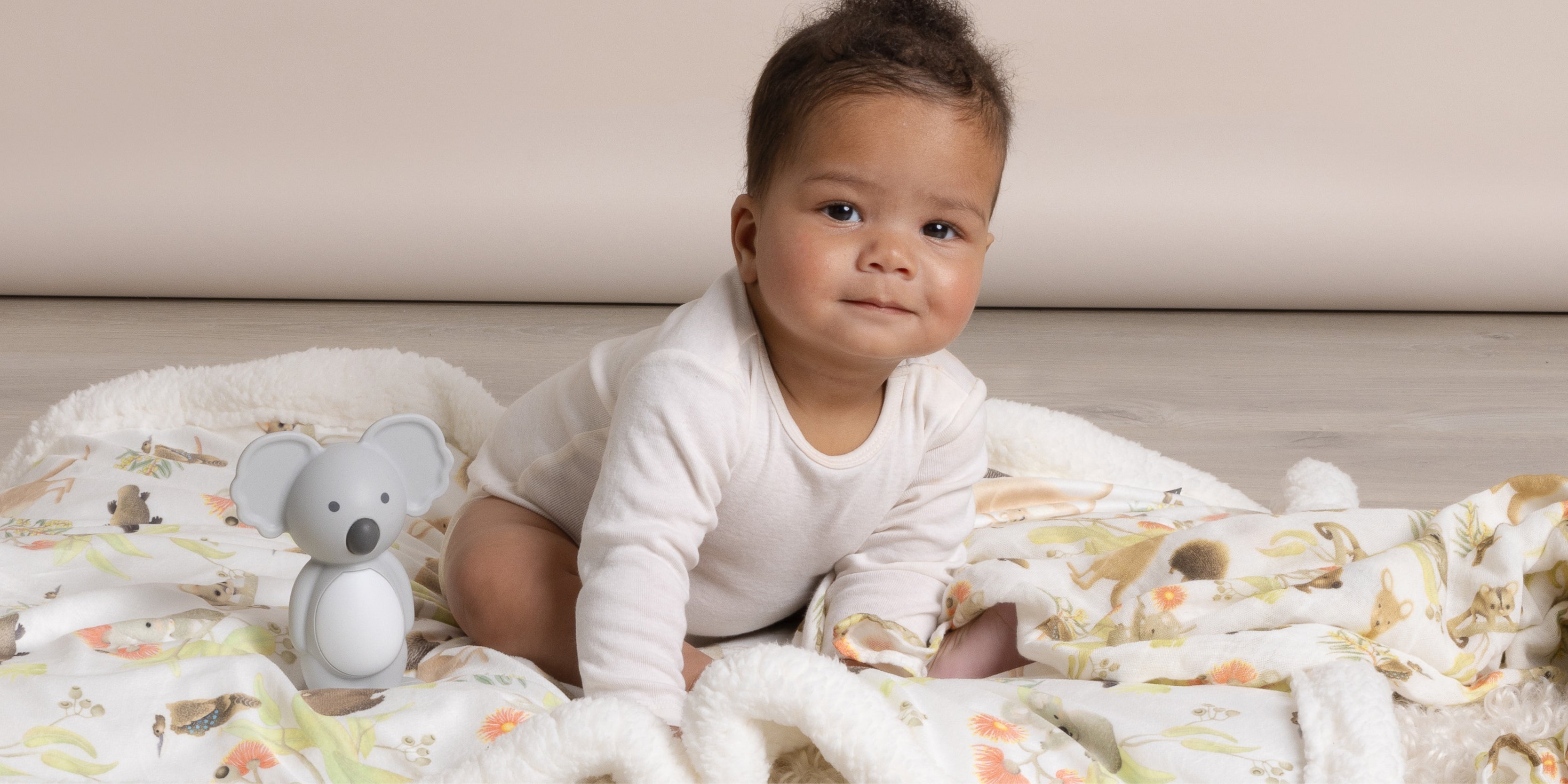 two babies wearing a koala and crocodile hooded baby bath towel