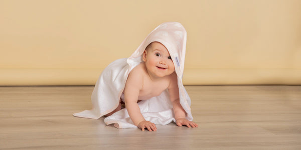 cute baby in a nordic print hooded towel